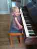 Playing Auntie Emma's piano