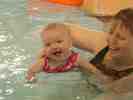 Floating in the pool with Mummy