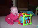 Playing with her activity centre