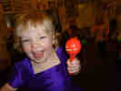 Lucy shaking a maracas